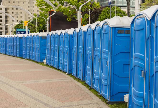 multiple portable restrooms in a neat and tidy row in Broad Brook, CT